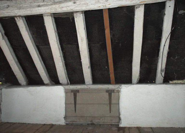 A cheese vent viewed from inside the attic