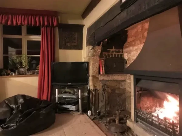 Fireplace with bread oven and spice cupboard