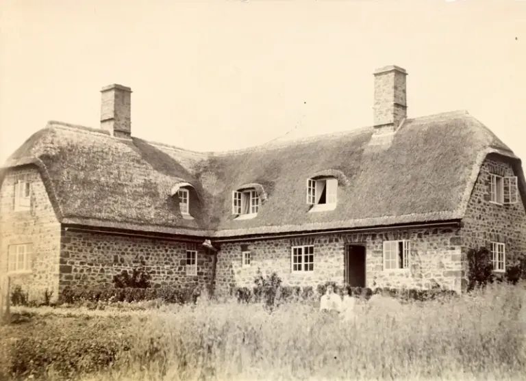 The two thatched cottages shortly after completion. (note the two children in front of the door, possibly Michael and Lorna, Hugh’s father and aunt?