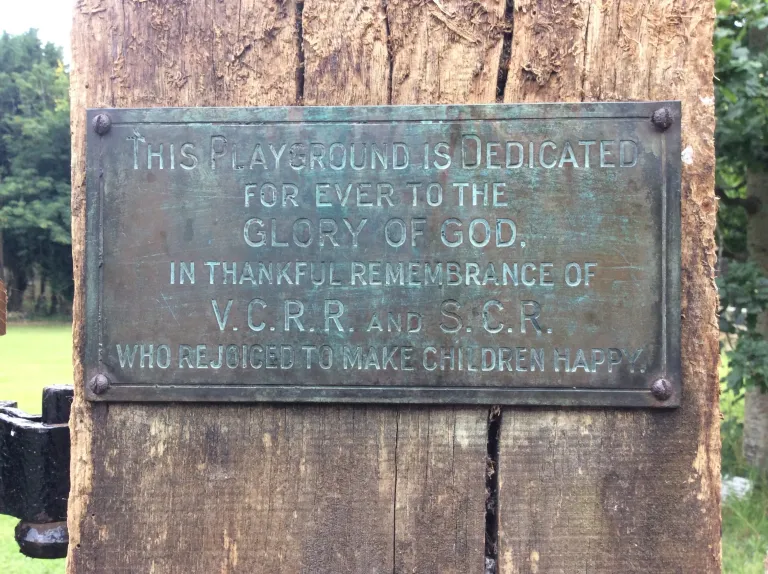 Brass plaque with Rev. & Mrs Reynell’s initials on Church Field gatepost