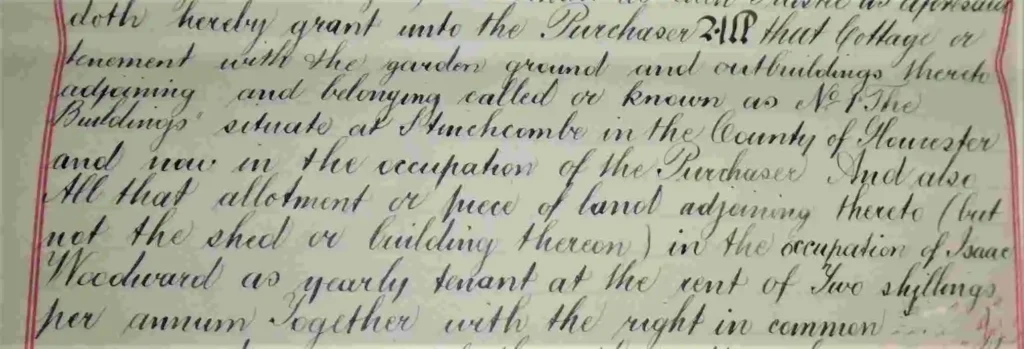 Close-up of a 19th‑century handwritten land deed with cursive text describing property and occupancy, bordered in pink.