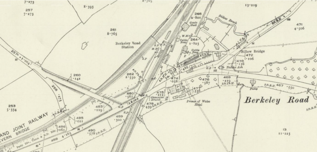 Old map excerpt of the Berkeley Road area showing a railway junction and bridge crossing a road, with surrounding streets and buildings labeled nearby.