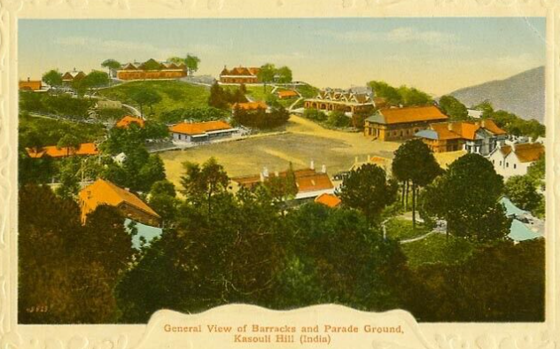 Vintage postcard of Kasouli Hill, Indore: hilltop military barracks with orange-roofed buildings surrounding a central parade ground, framed by trees.