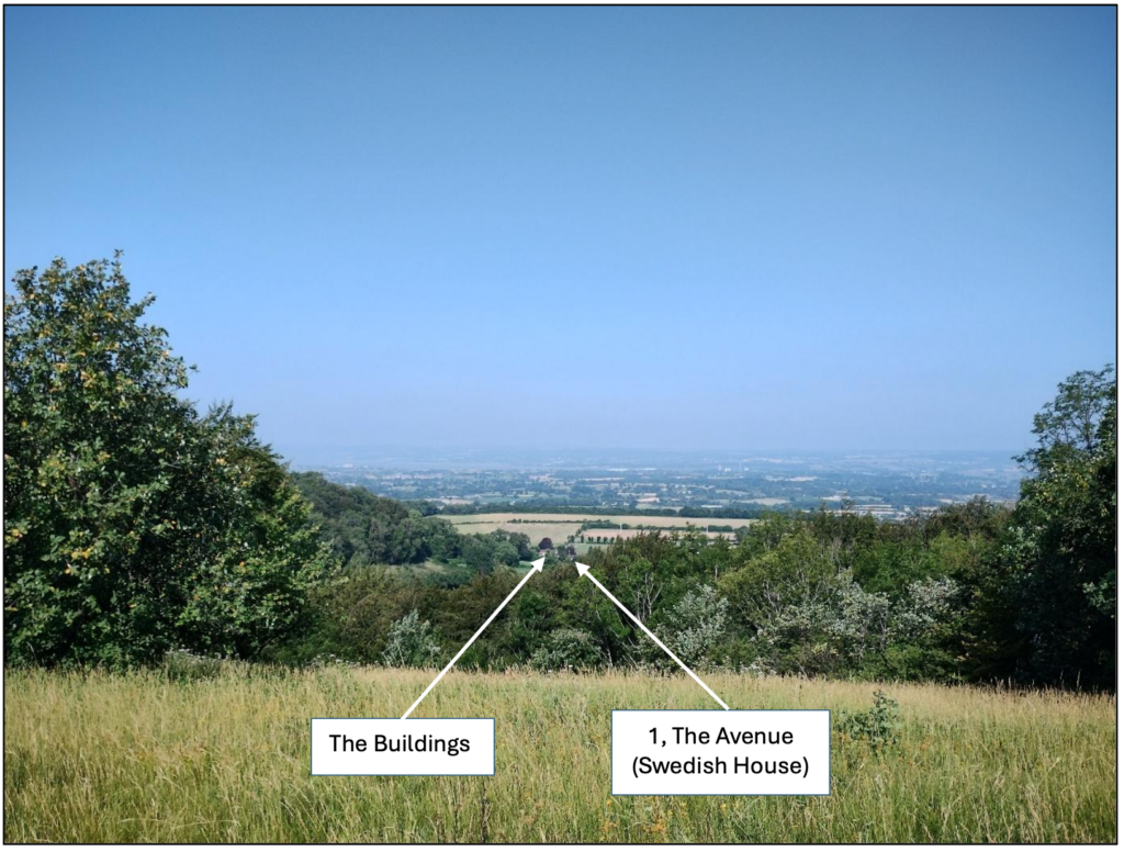 Wide rural landscape with grassy foreground and trees on both sides; two white arrows point to distant buildings labeled 'The Buildings' and '1, The Avenue (Swedish House)'